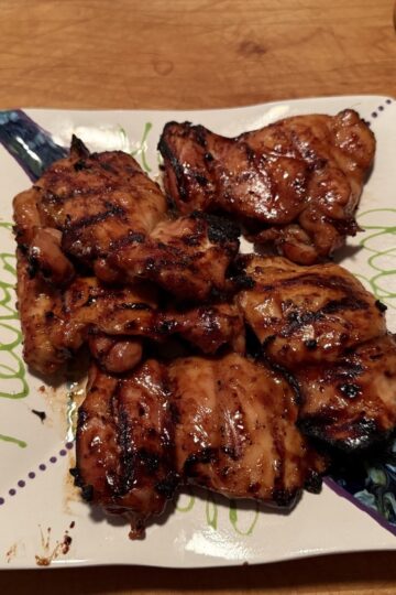Bourbon Grilled Chicken ready to serve on decorative white platter