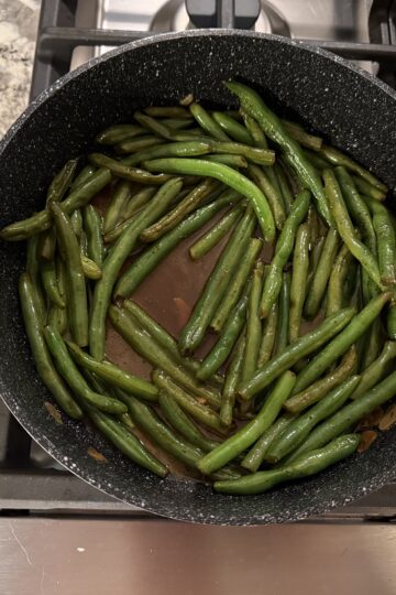 Ready to serve Skillet Green Bean in skillet. Cooked in butter, garlic, and low-sodium soy sauce.